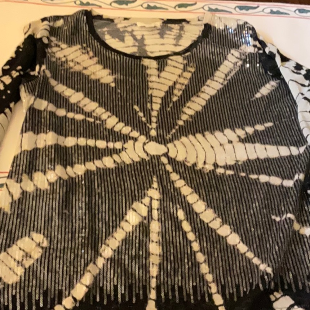 Gorgeous sequin and soft knit top.  Sleeve adjustable!